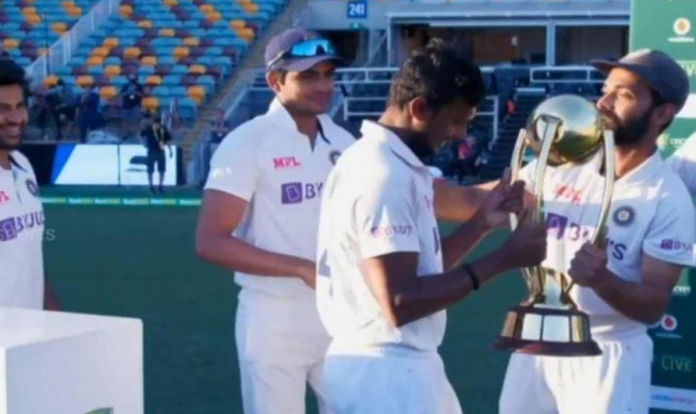 Rahane Handing Over The Test Trophy To Debutant T Natarajan