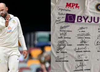 Nathan Lyon reacts on receiving a Signed Jersey from India
